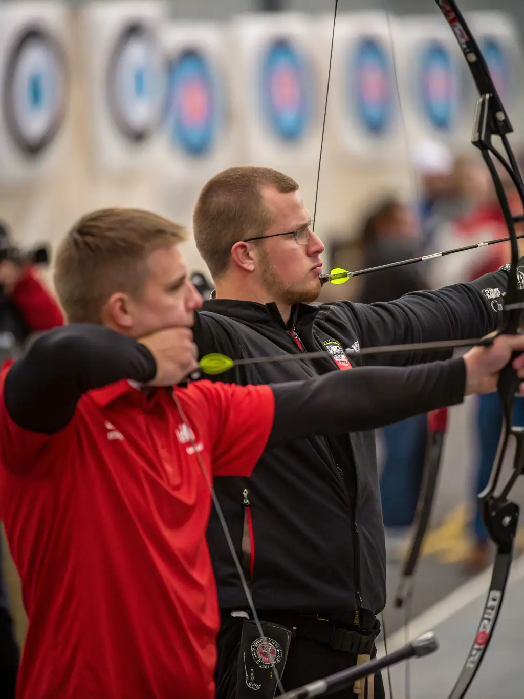 A scenic shot of archers practicing outdoors in a natural setting, emphasizing the recreational and therapeutic aspects of archery, available through SROTA's outdoor programs.