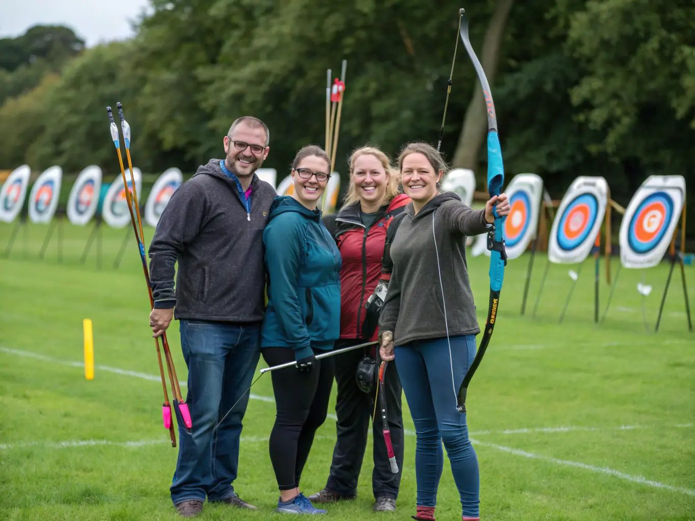 A group of archers participating in a recreational archery session, enjoying the camaraderie and fun of the sport in a relaxed outdoor setting. The image captures the social aspect of the club.